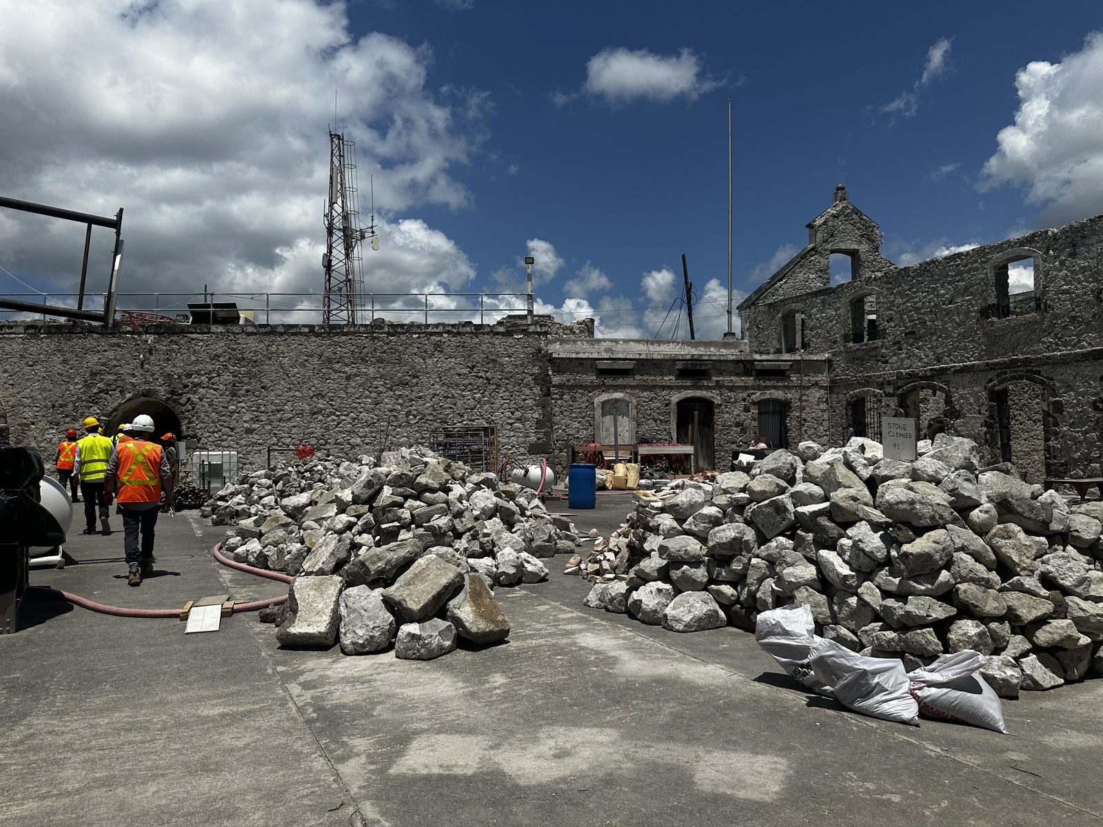 Restoration crews cataloguing cleaned stone in the fort courtyard