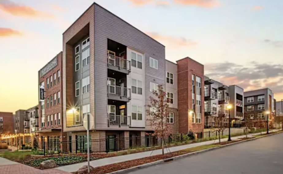 Modern multifamily community at sunset